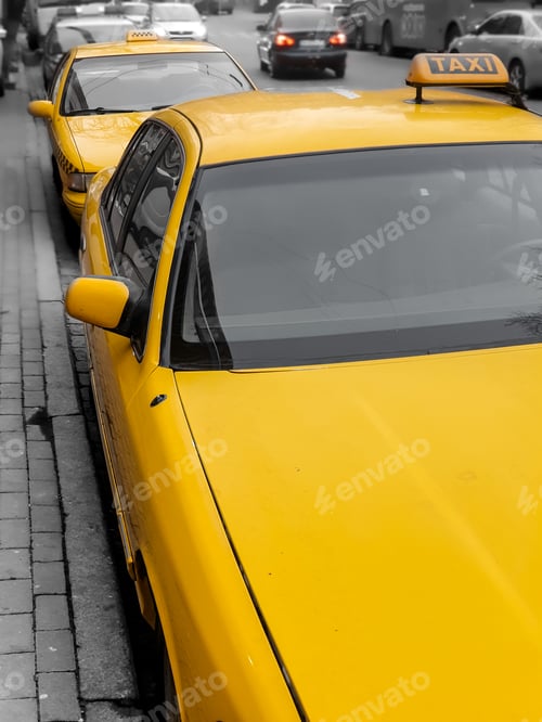 Preview: Taxi parking on the city street. Classic yellow taxi cars in New York