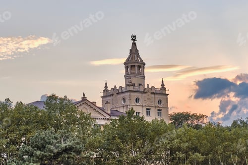 Preview: Stalinist empire-style building with spire against scenic sunset sky in Novorossiysk, Russia