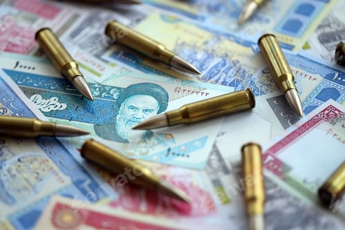 Preview: Many bullets and iranian rials money bills close up