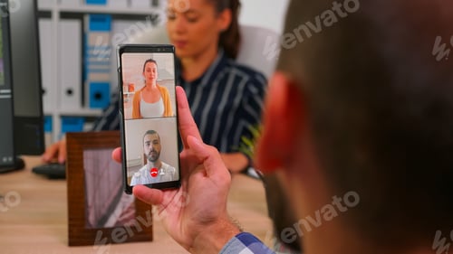 Preview: Entrepreneur talking on videocall with company manager