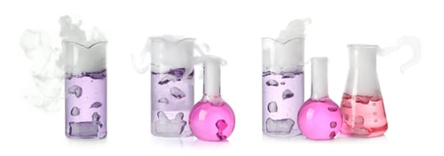 Preview: Set of laboratory flasks and beakers with colorful liquids on white background. Chemical reaction