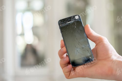 Preview: the person's hands holding a crashed broken phone, mobile smartphone
