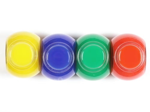 Preview: Jars With Bright Paint Stand On The Table Has A Place For Writing