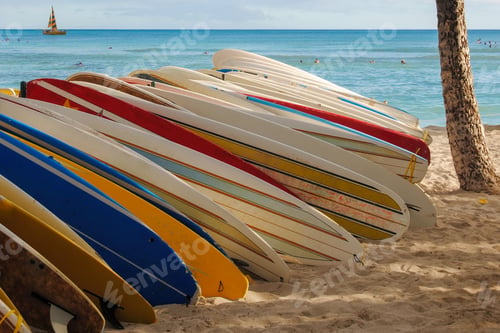 Preview: Several surfboards displayed on a rack at a beach in Hawaii