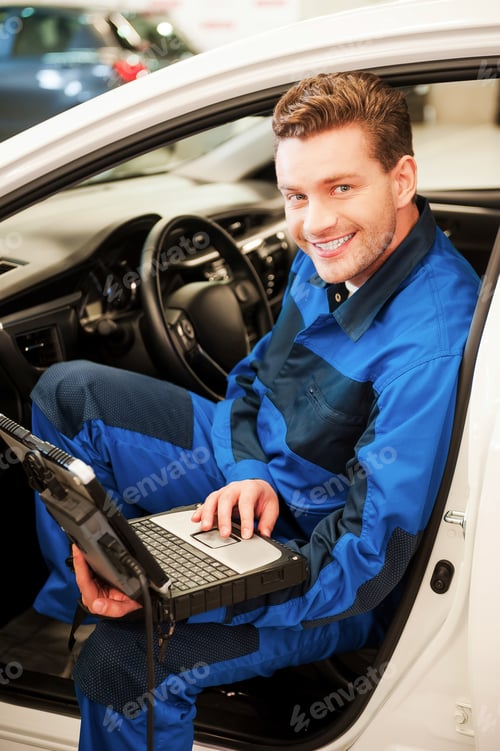 Preview: Examining car with special computer.