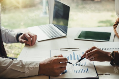 Preview: Business Professionals Analyzing Charts at Office Workplace