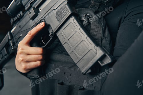 Preview: Female sniper preparing to fire a weapon
