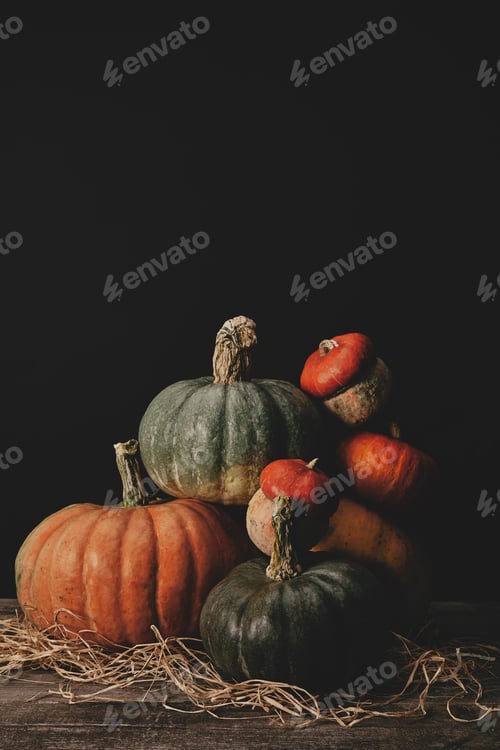 Preview: pile of ripe pumpkins on table, halloween concept