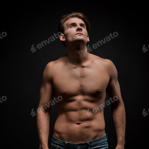 Preview: handsome sexy man posing isolated on black