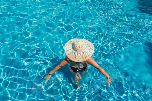 Preview: woman in luxury spa resort near the swimming pool.