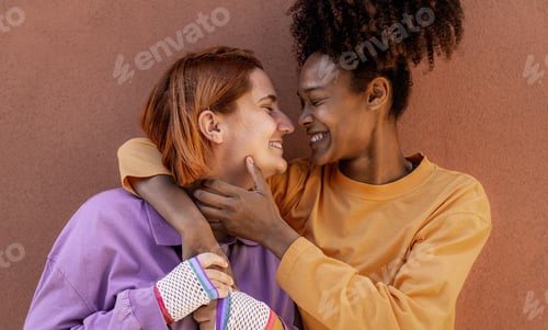 Preview: Lesbian couple having tender moments outdoor - Lgbt and love relationship concept