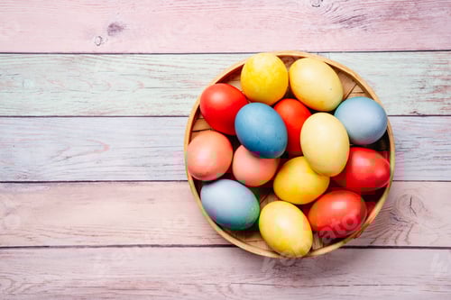 Preview: Colorful Easter Eggs in a Basket on Wood