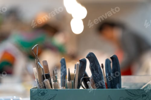 Preview: Pottery classes. Tools and utensils on the work table.