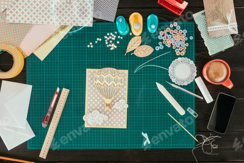 Preview: Top view of handmade scrapbooking postcard on a table