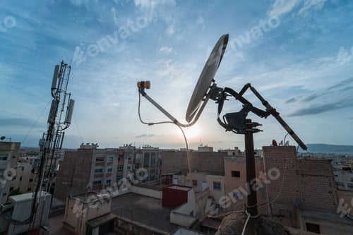 Preview: TV satellite dish with sunset sky in the background