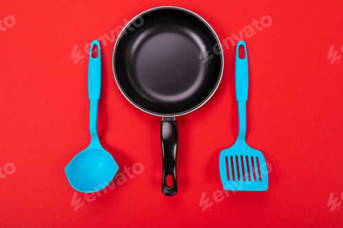 Preview: Kitchen utensils for cooking in kitchen isolated with copyspace on red background