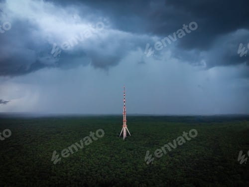 Preview: High communications tower antenna in the forest drone view