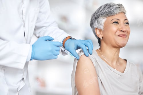 Preview: Healthcare, vaccine and doctor with mature woman in consultation at hospital or clinic. Injection,