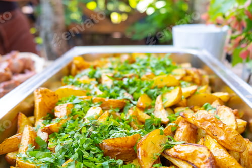 Preview: baked potatoes with herbs on a tray