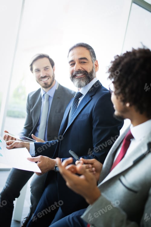 Preview: Successful team leader and business owner leading informal in-house business meeting