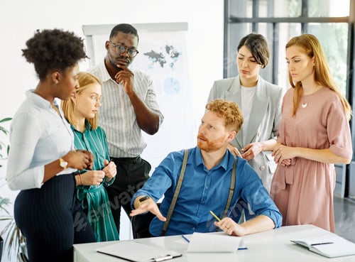 Preview: Young people having a meeting in the office