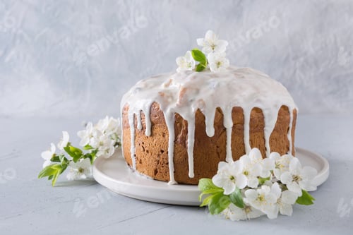 Preview: Easter cake decorated spring fresh flowers. Close up.