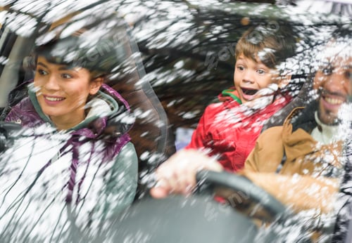 Preview: View through the window of Happy friendly family travelling by car in autumn forest