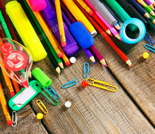Preview: School tools. On wooden background.