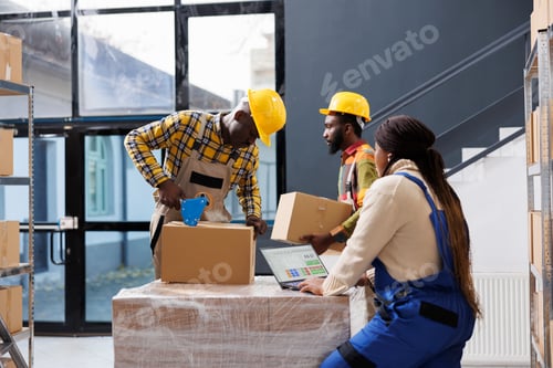 Preview: Warehouse managers team preparing customer order for delivery