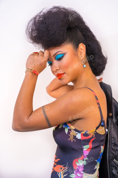 Preview: A closeup portrait of a sexy attractive rocker style woman with bright makeup