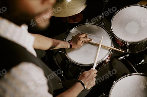 Preview: Black Man Sitting At Drum Kit