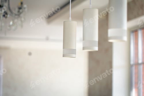 Preview: Chandelier in the interior of the room, lamps in white shades.