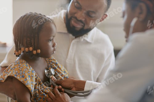 Preview: Examining Child with Stethoscope in Medical Office