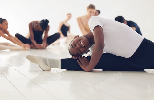 Preview: Shot of a group of ballerinas warming up before practicing their routine