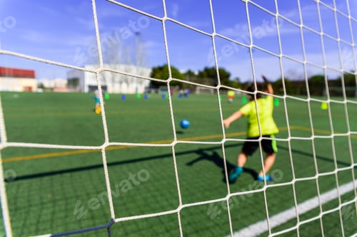 Vista previa: Soccer ball entering a goal defended by a goalkeeper, copy space