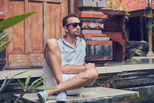 Preview: Man Sitting On A House Patio / Porch And Enjoying Summertime.