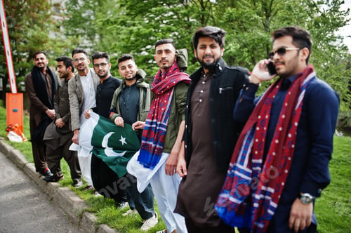 Preview: Group of pakistani man wearing traditional clothes salwar kameez or kurta with Pakistan flags.
