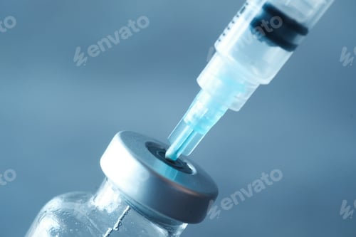 Preview: glass vial and syringe on black background