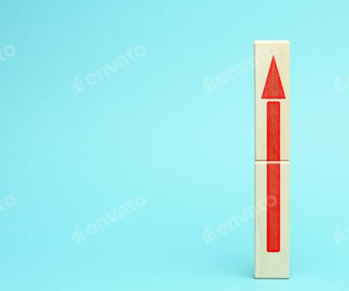 Preview: Wooden block with an upward arrow on a bluee background, the process of growth