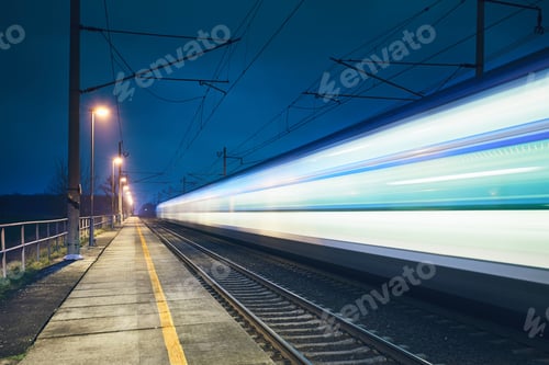 Preview: Light trail of the express train in the railway station at the night.