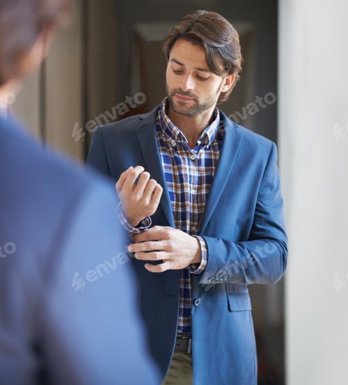 Preview: Getting ready for the day. Shot of a handsome man getting ready for work.