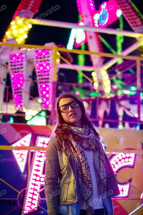 Preview: Stylish young woman near illumination on street