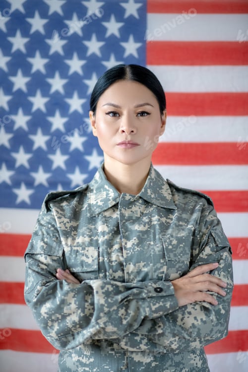 Preview: Beautiful Asian servicewoman wearing military camouflage uniform