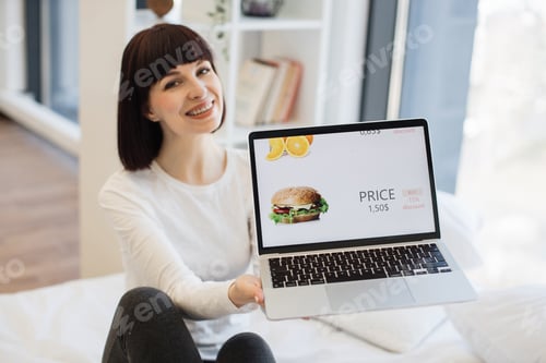Preview: Woman buying burger with 15 percent discount on laptop