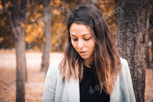 Preview: Woman with Long Brown Hair in Autumn Setting