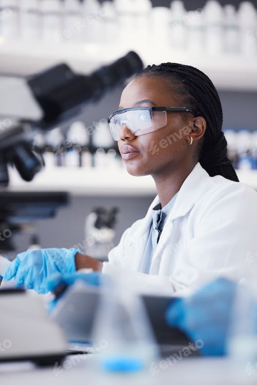 Preview: African scientist woman, laboratory and microscope analysis with thinking, pharmaceutical company o