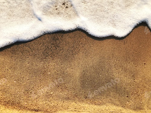 Preview: Sea foam on golden sand