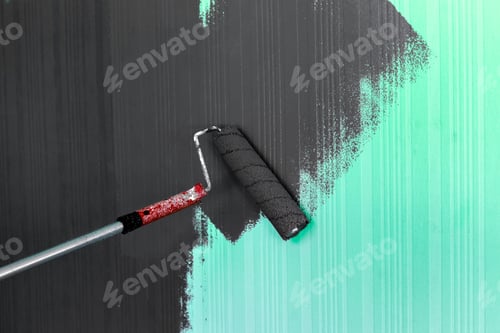 Preview: Painting a wall with black paint on a teal background in a modern interior space