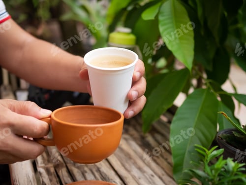 Preview: Hand barista Hot Black Coffee in white cup with coffee beans