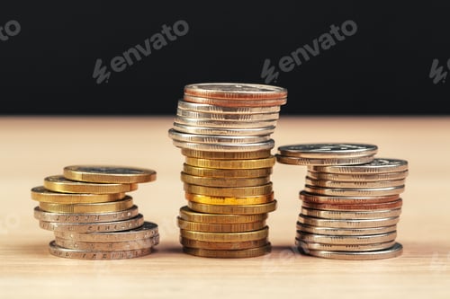 Preview: piles of coins on working table